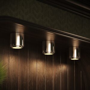 Moderne 6" flush mount in polished nickel in a row over a dark wood bar