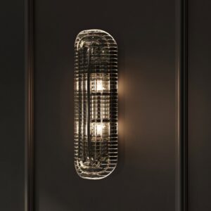 Florian 24" textured glass wall sconce in polished nickel on a black paneled wall