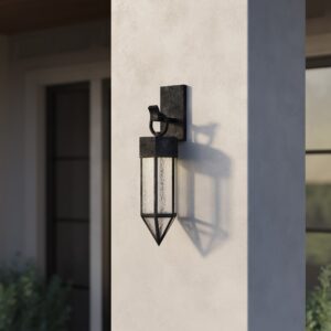 Giza pyramid outdoor wall lantern in dark oil-rubbed brass on a white stucco exterior wall